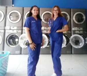 Two Family Laundry staff inside one of the branch locations